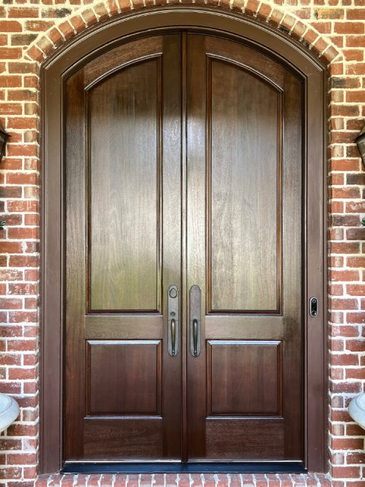 Restored wooden door with a fresh, renewed finish